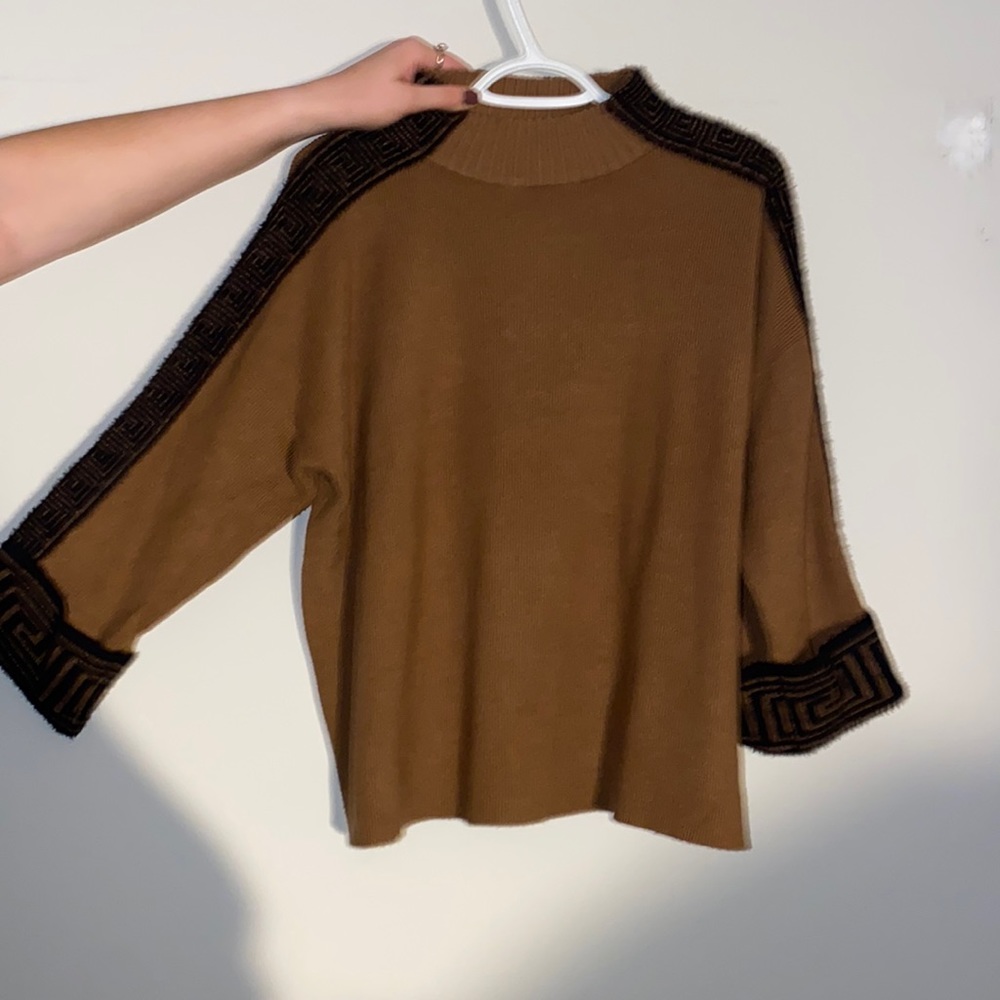 Very soft and comfortable. Turtle neck.